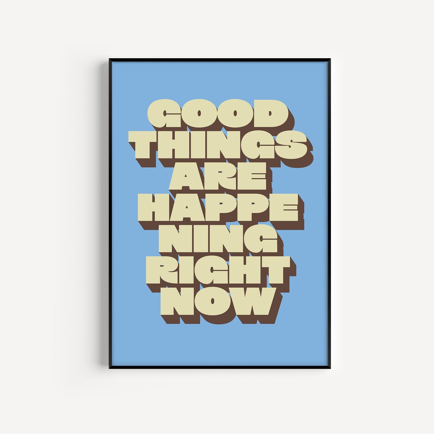 Framed poster with 'Good Things Are Happening Right Now' text on a blue background