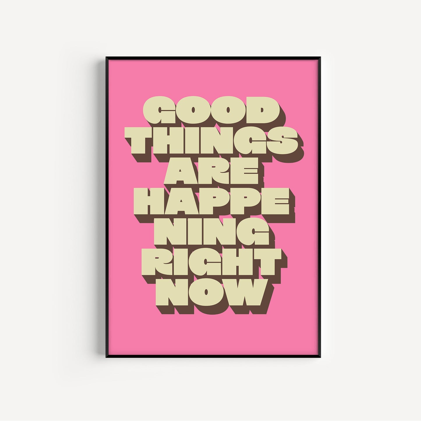 Framed poster with 'Good things are happening right now' text on a pink background