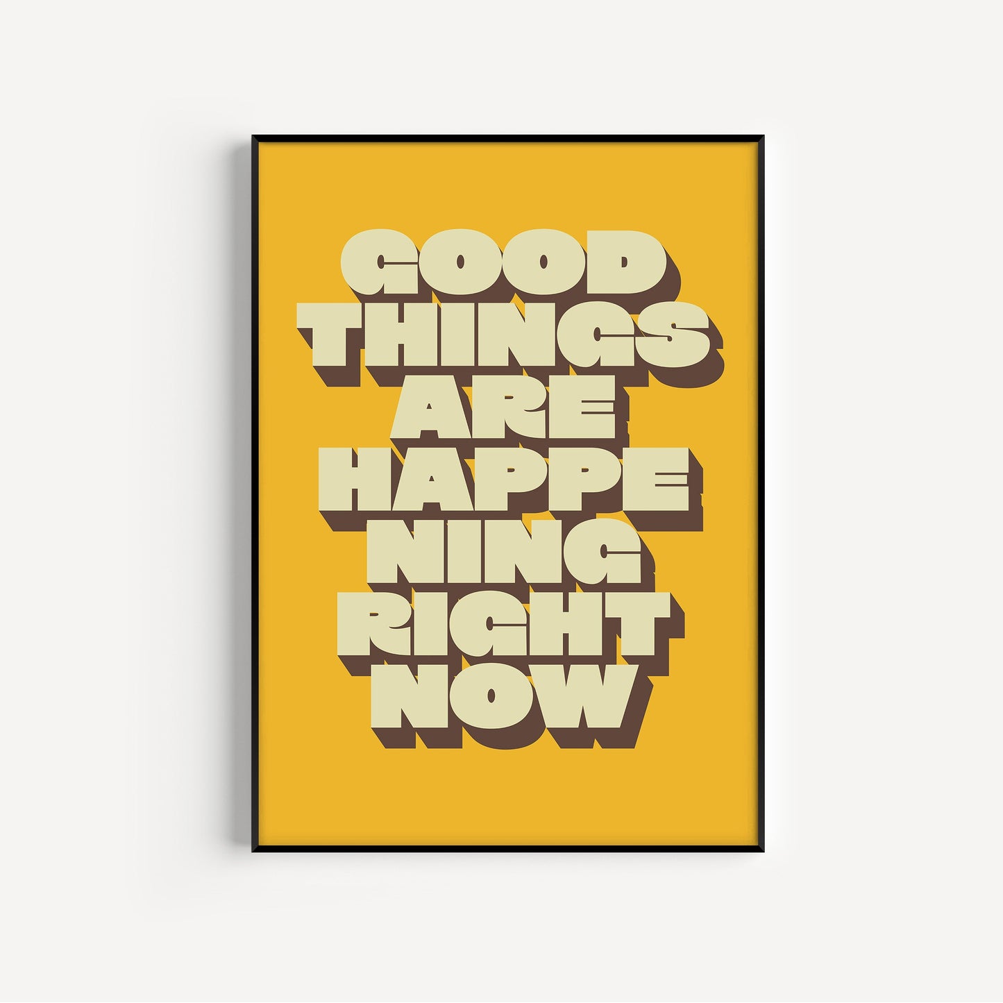 Framed poster with 'Good things are happening right now' text on a yellow background