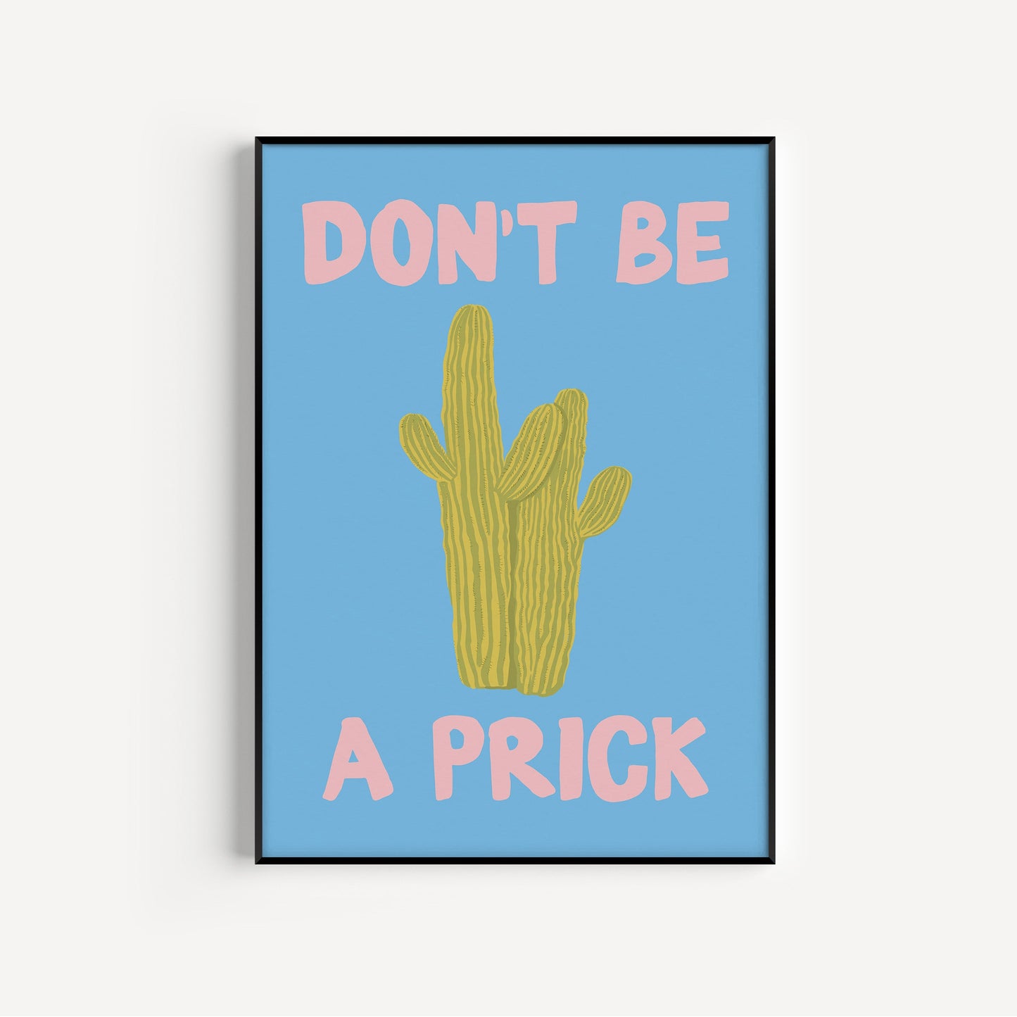 Framed artwork with a cactus illustration and text on a blue background