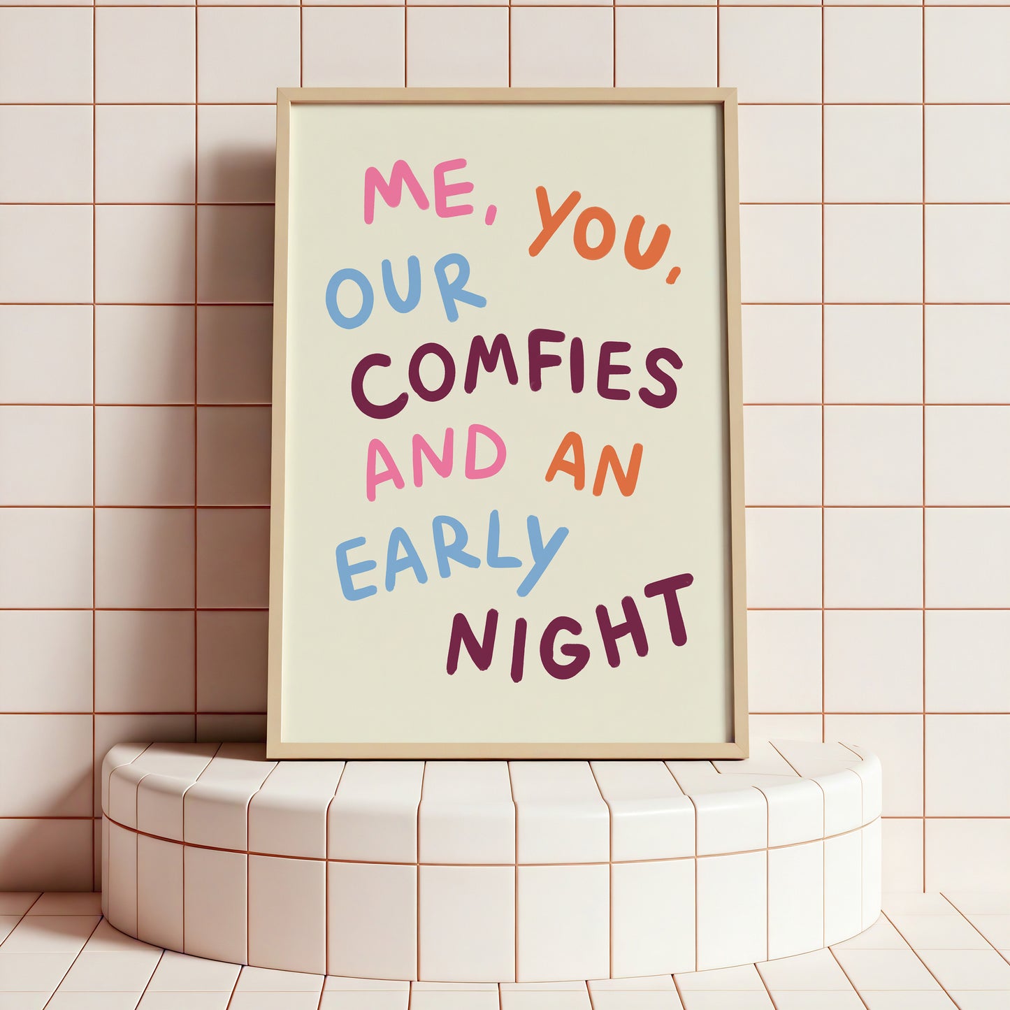 Framed poster with colorful text on a tiled wall
