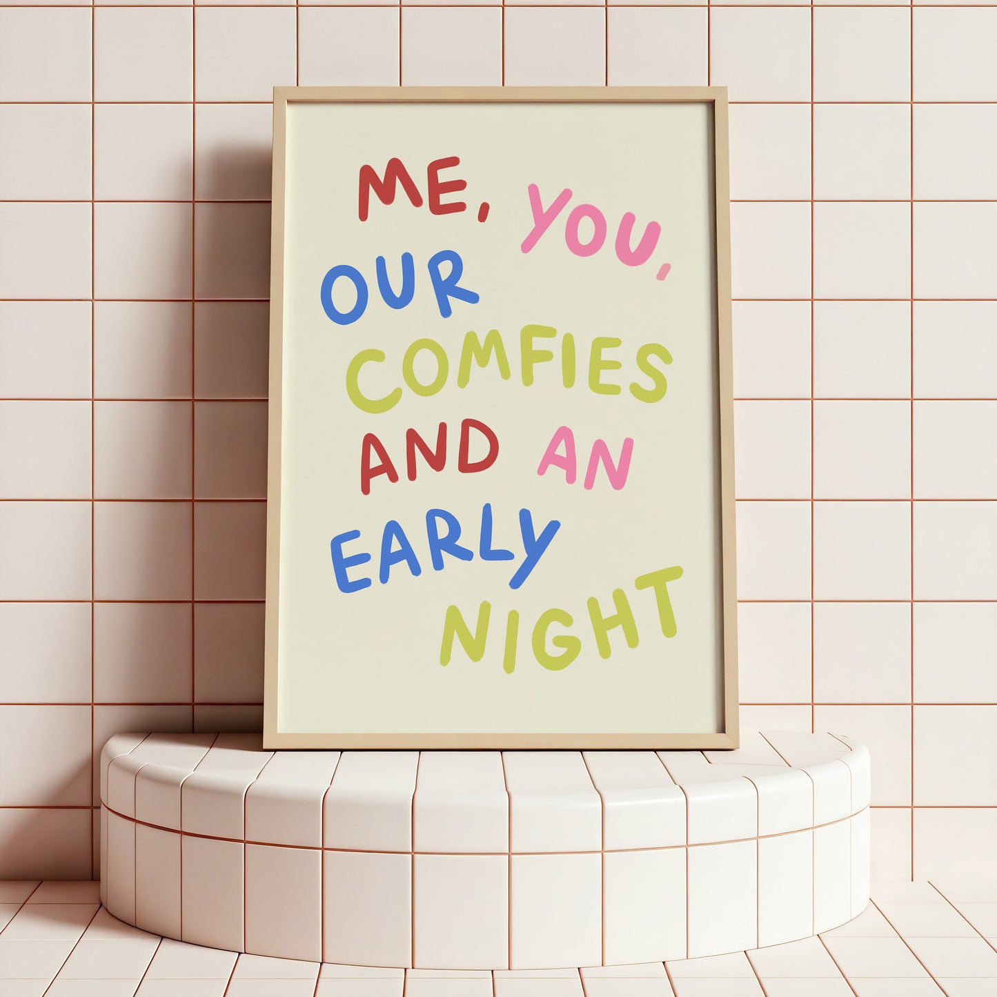 Framed poster with colorful text on a tiled wall
