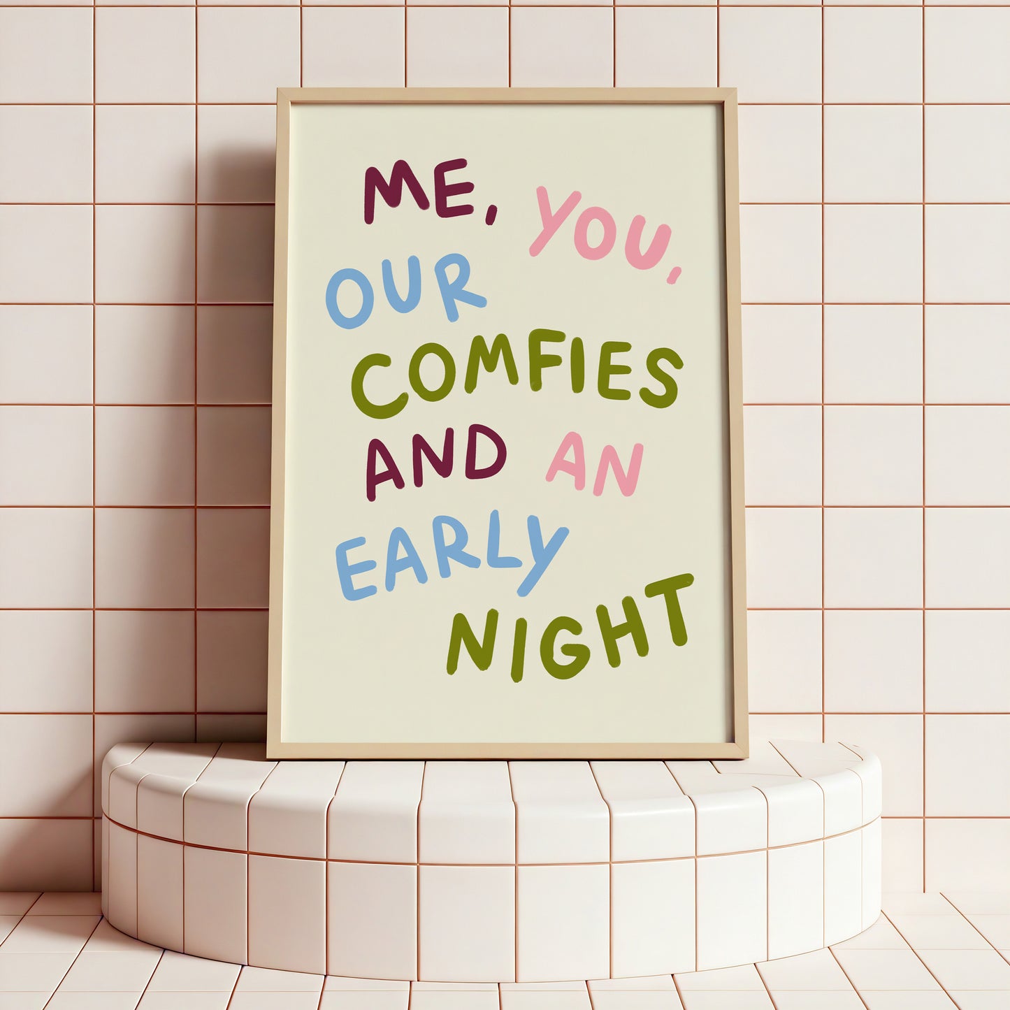Framed poster with colorful text on a tiled wall