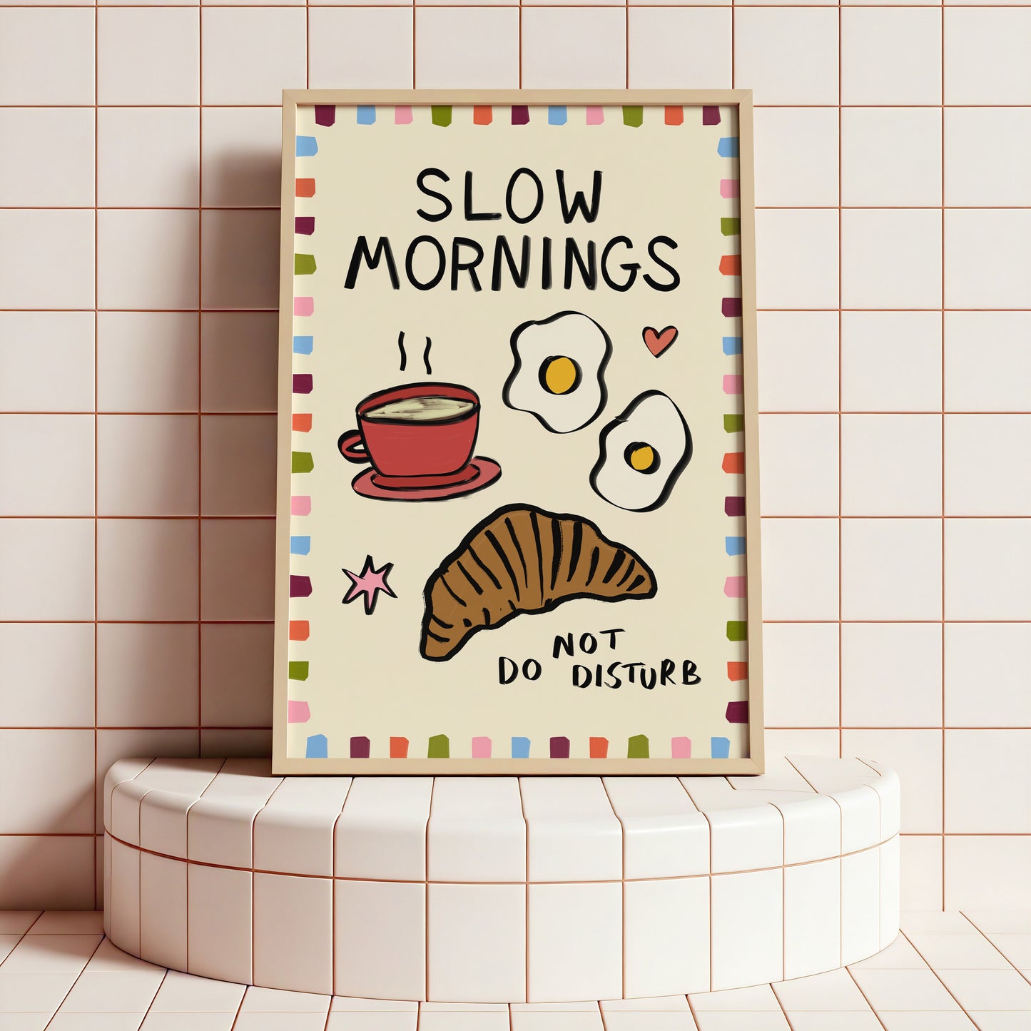 Framed artwork with 'Slow Mornings, Not Do Disturb' text and breakfast illustrations on a tiled wall.