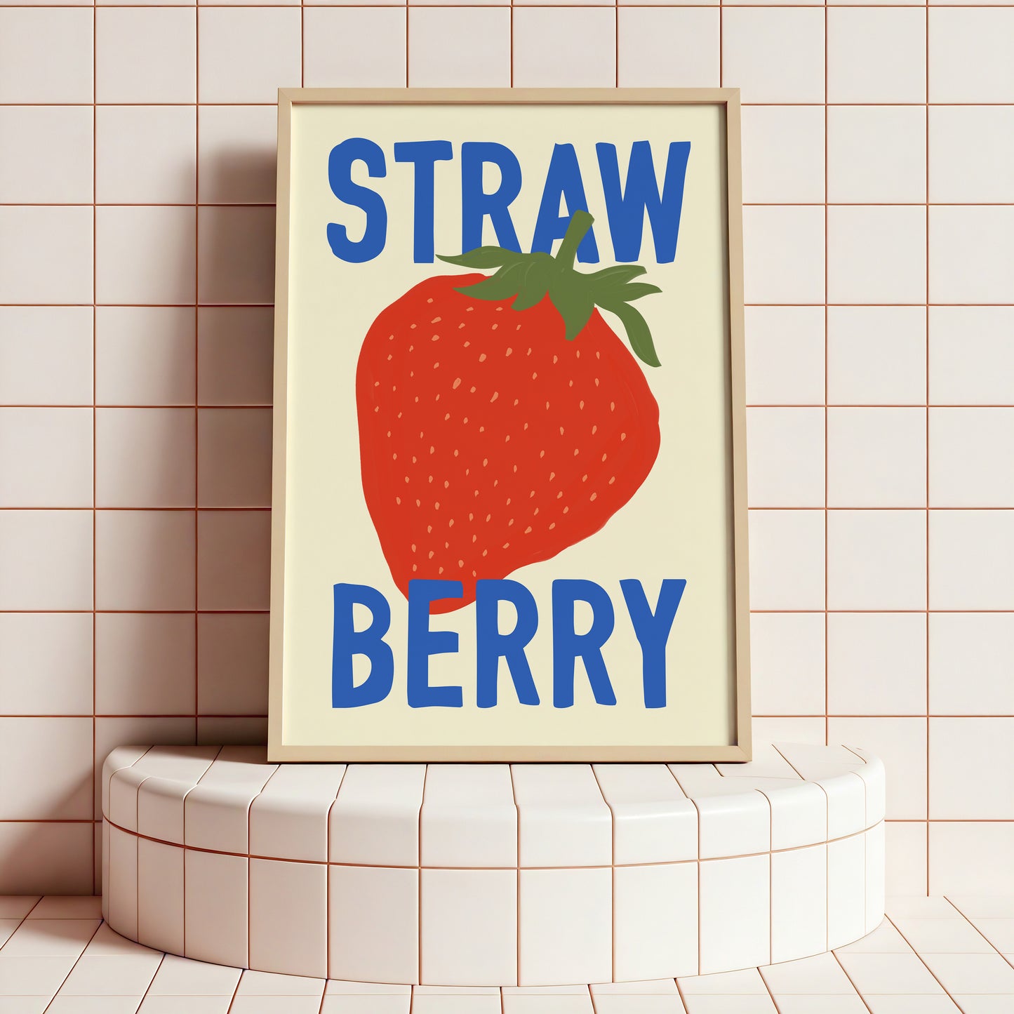 Framed artwork with a strawberry illustration and 'STRAW BERRY' text on a tiled wall.