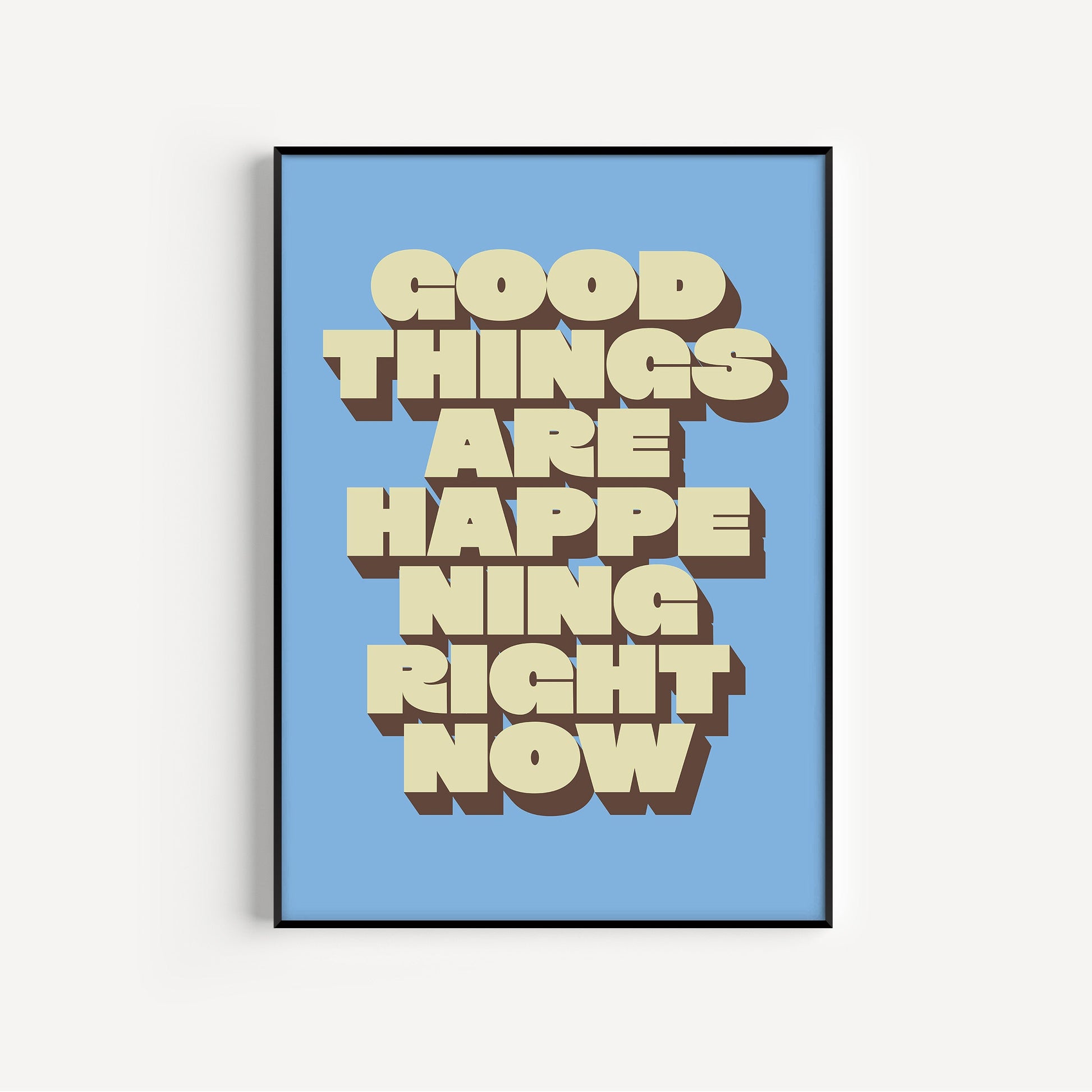 Framed poster with 'Good Things Are Happening Right Now' text on a blue background