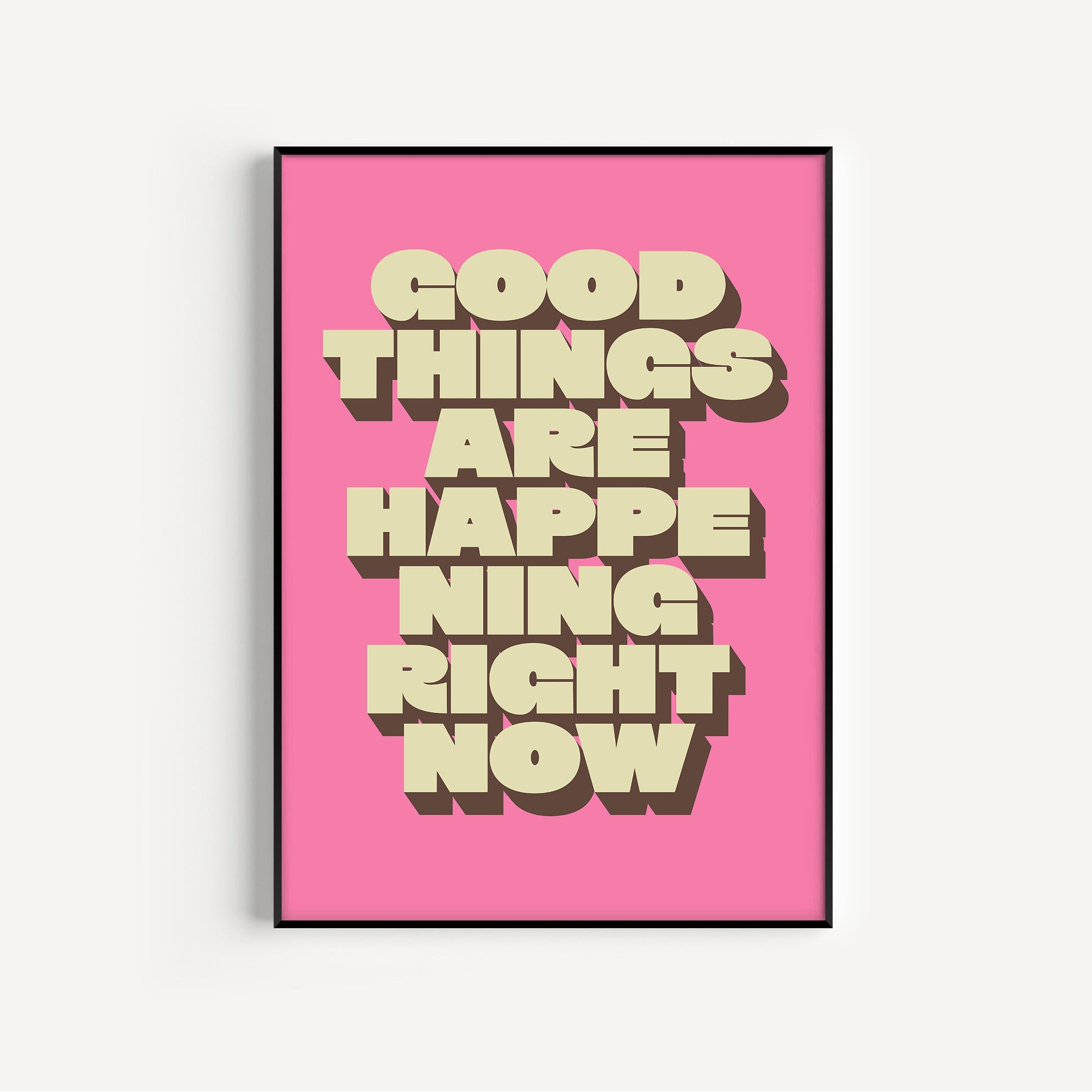 Framed poster with 'Good things are happening right now' text on a pink background