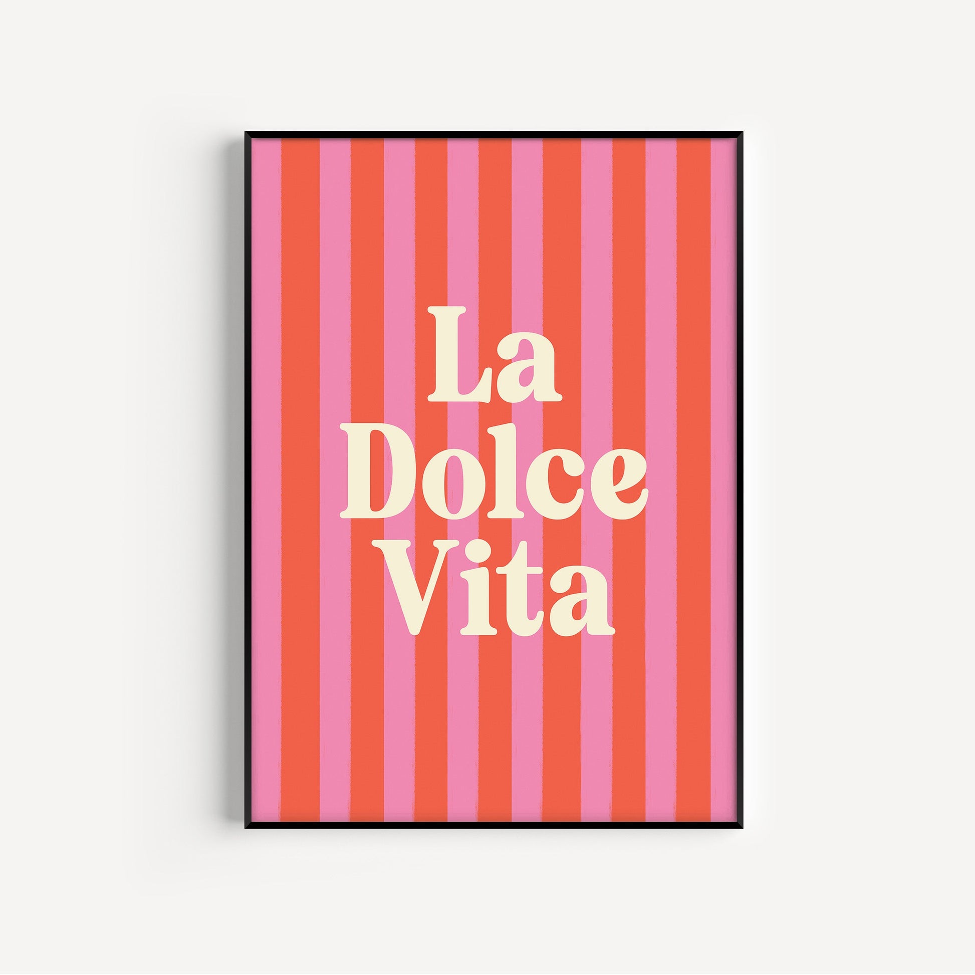 Framed artwork with 'La Dolce Vita' text on a striped background