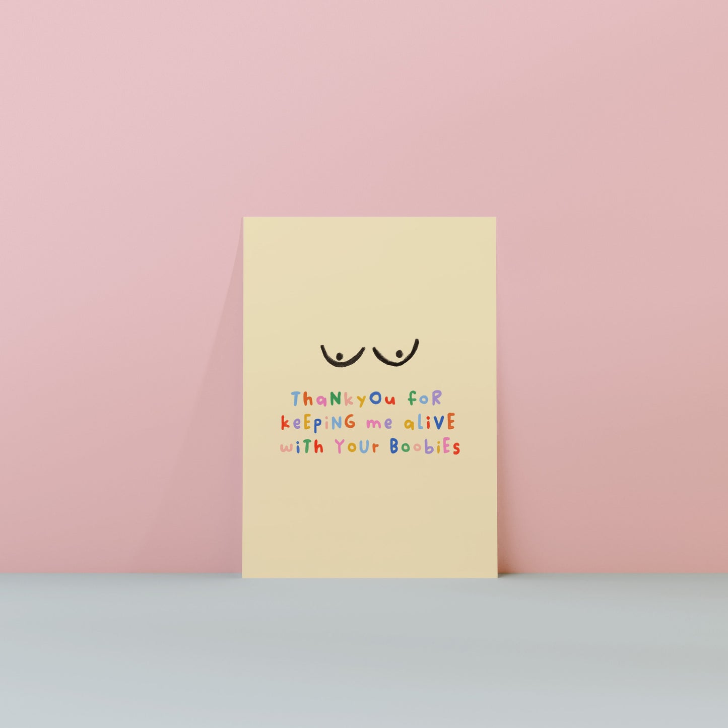 Yellow card with a smiley face and text on a pink background