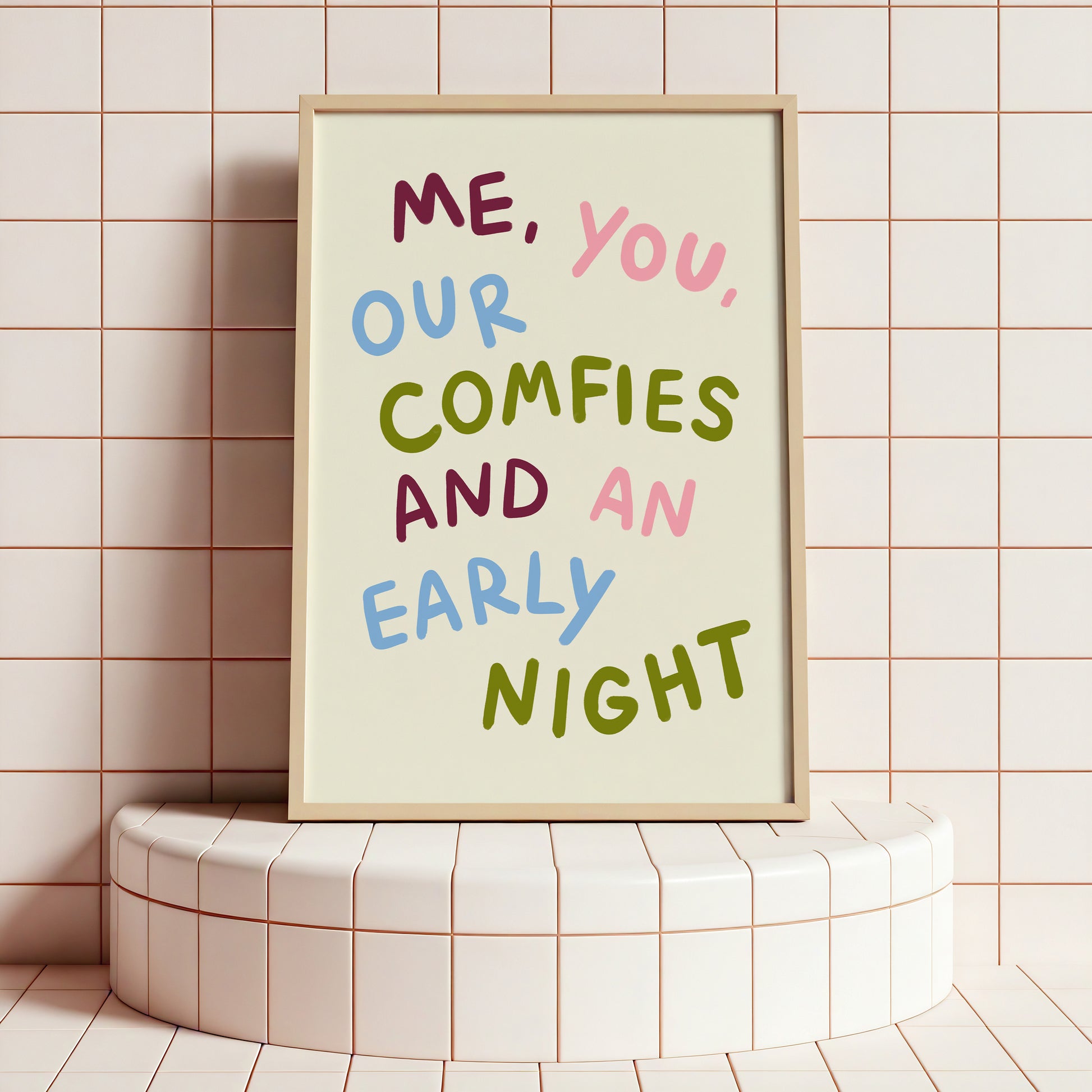 Framed poster with colorful text on a tiled wall