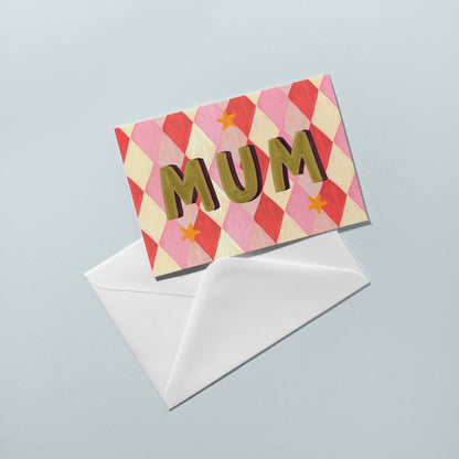 Greeting card with 'MUM' text on a checkered pattern with a white envelope below on a light gray background