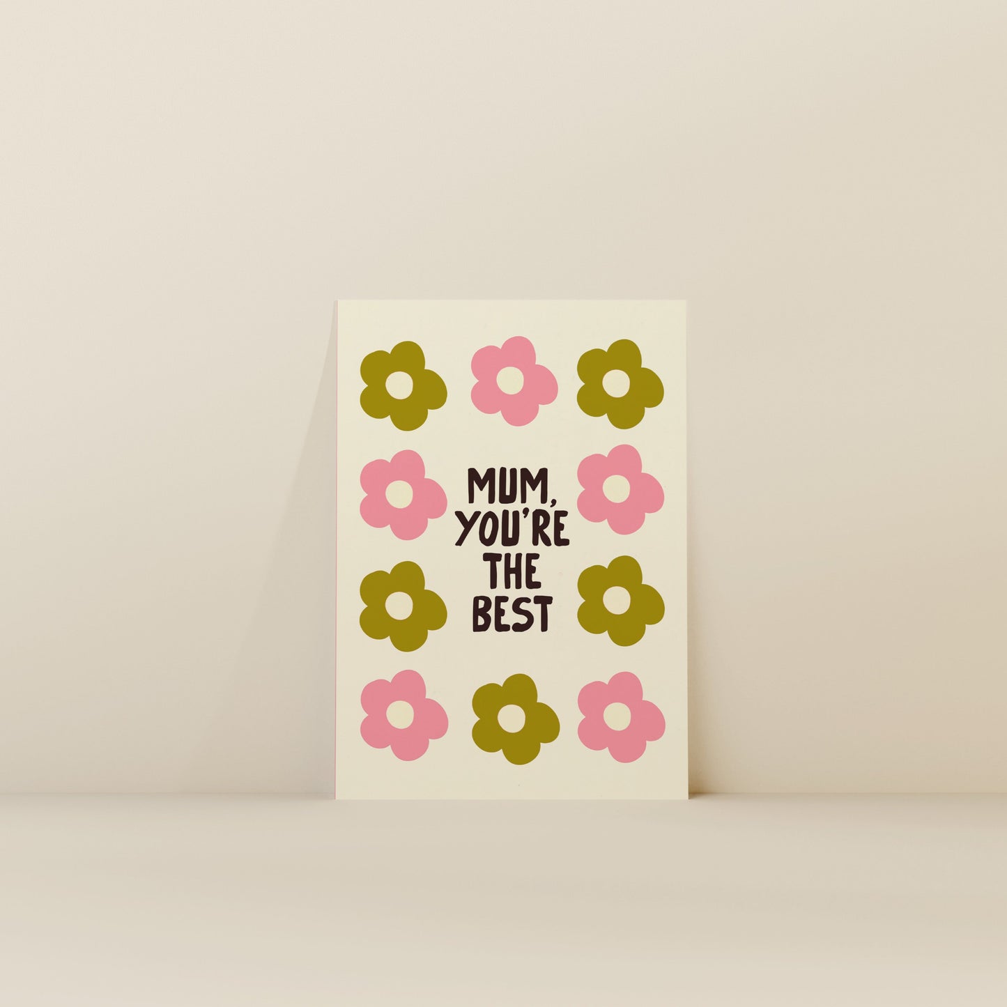 Card with floral design and text 'Mum, you're the best' on a beige background