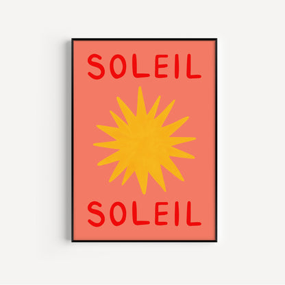 Framed artwork with 'Soleil' text and a yellow sun design on a red background.