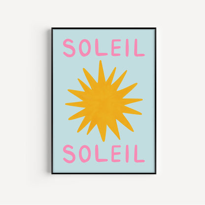 Framed artwork with a yellow sun and pink 'Soleil' text on a light blue background
