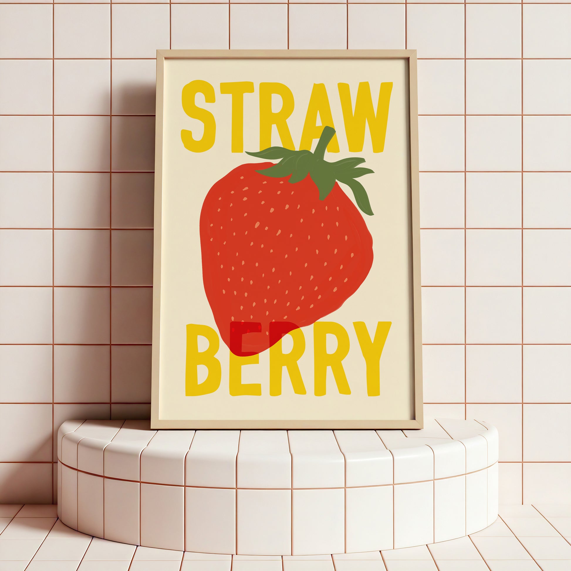 Framed artwork with a strawberry illustration and 'Strawberry' text on a tiled wall.